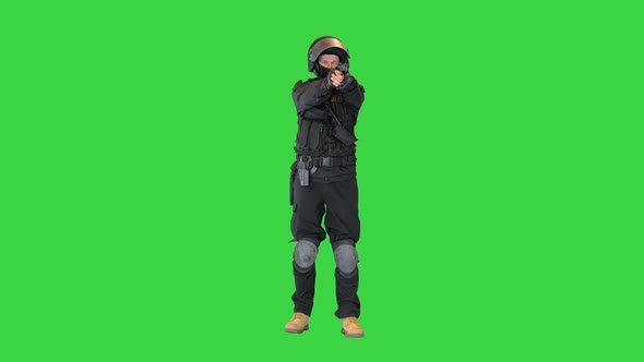 Police Tactical Unit Aiming with a Hand Gun on a Green Screen Chroma Key alt