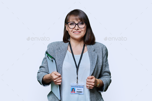 Confident woman with education center card on white background - Stock Photo - Images