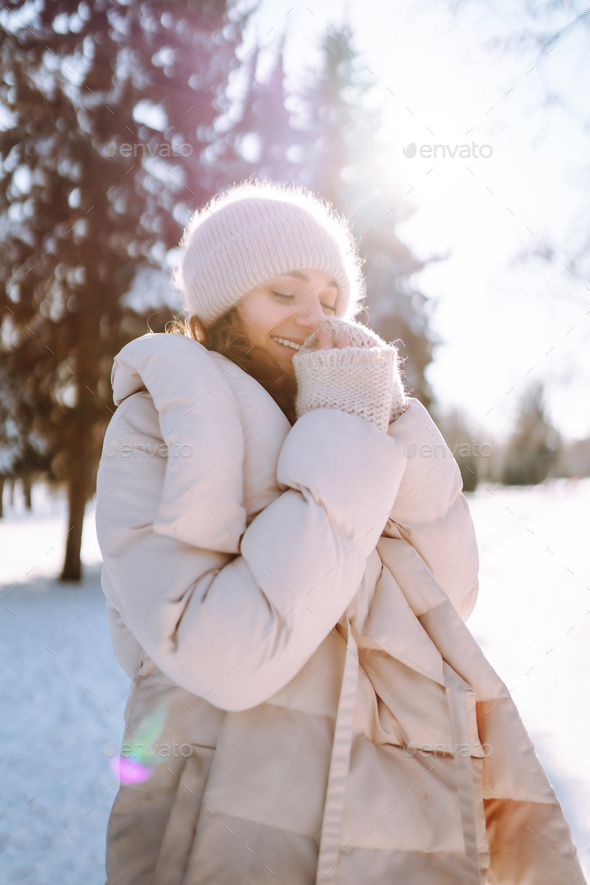 Beautiful young girl in stylish winter clothes walking near the house in  winter day 9856082 Stock Photo at Vecteezy