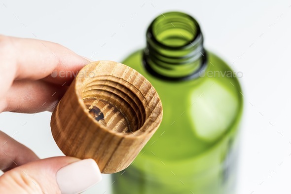 Wooden plastic free bottle cap for natural cosmetic beauty products. Zero Waste concept