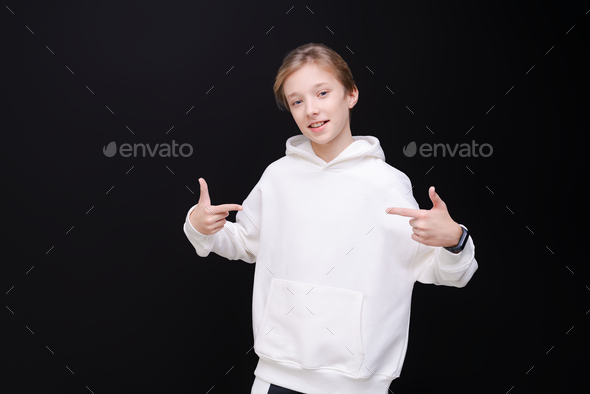 Cute portrait handsome young guy in white blank hooded sweatshirt or sweatshirt