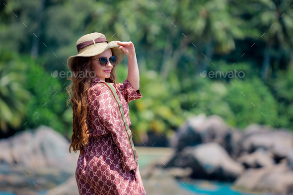 Woman with hat on the beach  - Stock Photo - Images