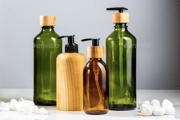 Glass and bottles for liquid cosmetic products with pumps. Zero Waste beauty products containers