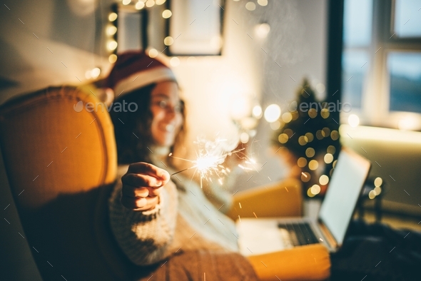 Woman celebrating Christmas online. - Stock Photo - Images