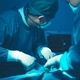 In a operating room, a doctor or medical team is performing a surgical procedure. - PhotoDune Item for Sale