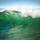 A wave of green water as the sun shines through it  - PhotoDune Item for Sale