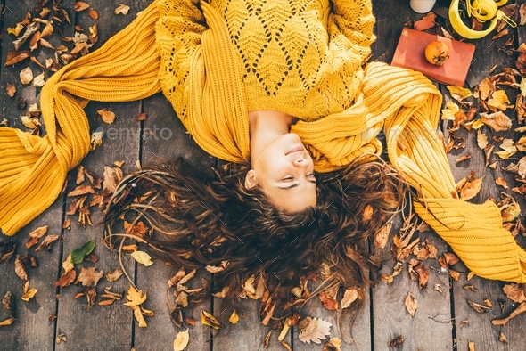 Woman laying at autumn park. - Stock Photo - Images