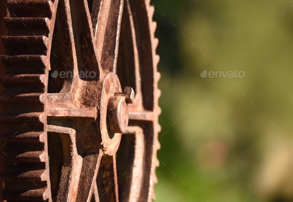 Rusty cog on old machinery with space for copy  - Stock Photo - Images