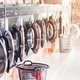 Row of industrial laundry machines in laundromat in a public laundromat, with laundry in a basket - PhotoDune Item for Sale