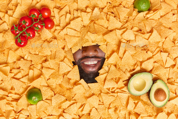 Overhead Shot Of Optimistic Dark Skinned Bearded Man Covered With