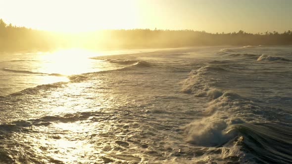 Following large waves at sunrise