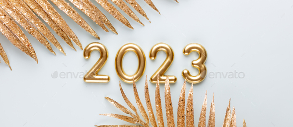 Happy New Year 2023 poster. Christmas background with gold 2023 numbers.  Stock Photo by GitaKulinica
