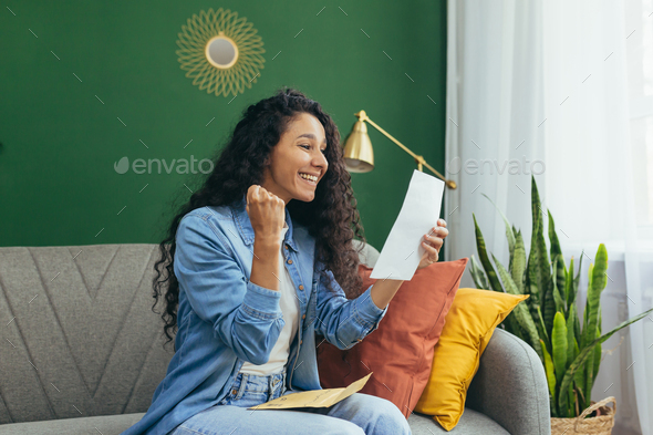 A girl Latin American student received a letter with a notification admission to the university - Stock Photo - Images