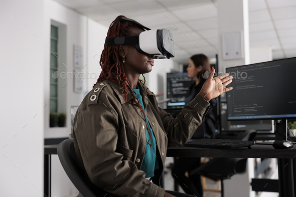 It programmer working with virtual reality headset to develop server app in it big data office