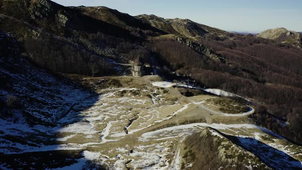 Aerial, Alps Mountains Partially Covered With Snow In Italy