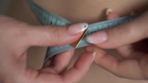 Young Woman with Measuring Tape Measure Waist alt