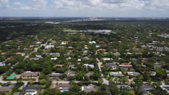 Aerial View of a South Florida Neighboorhood with Miami Skyline in the Distance alt