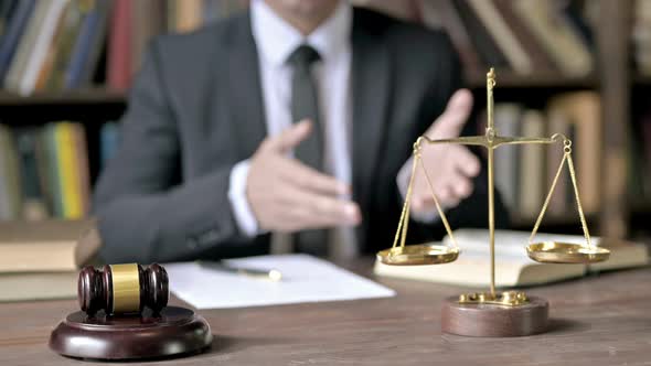 Close Up Shoot of Judge Hand While Conversation in Court Room alt