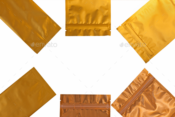 Golden metalized side gusset pouch bag isolated on white background. Empty blank foil coffee