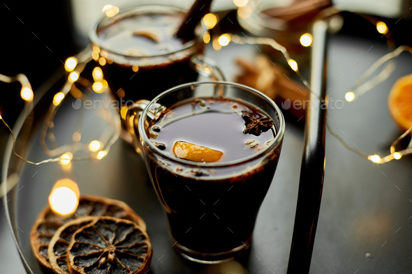 Christmas mulled red wine with spices and oranges - Stock Photo - Images
