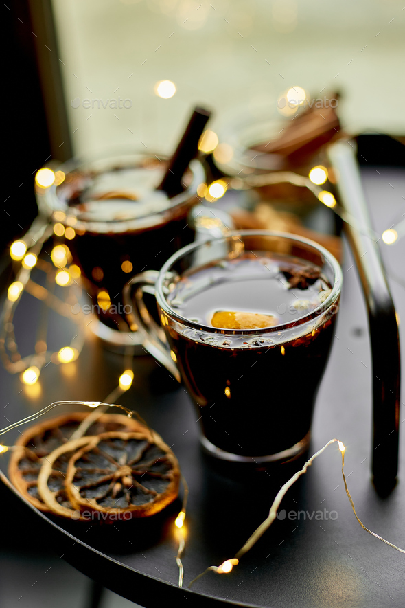 Christmas mulled red wine with spices and oranges - Stock Photo - Images