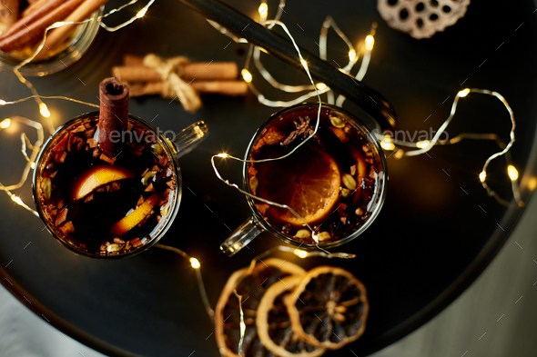 Christmas mulled red wine with spices and oranges - Stock Photo - Images