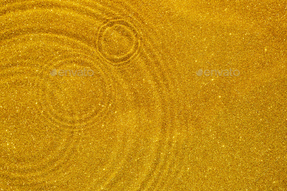 Abstract golden sparkling background with ripples and waves on the ...