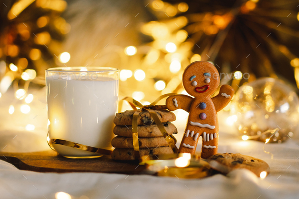 Christmas cookies and glass warm milk. Winter holiday Santa breakfast. - Stock Photo - Images