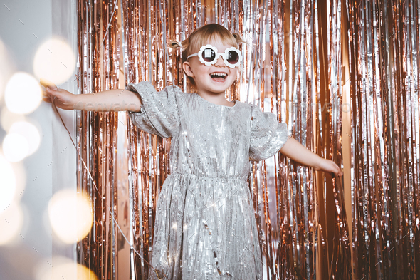 Festive background with foil curtain decorations for kids birthday or fancy dress party