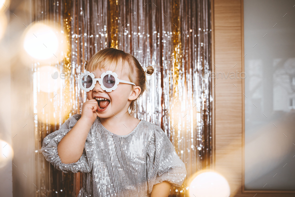 Festive background with foil curtain decorations for kids birthday or fancy dress party