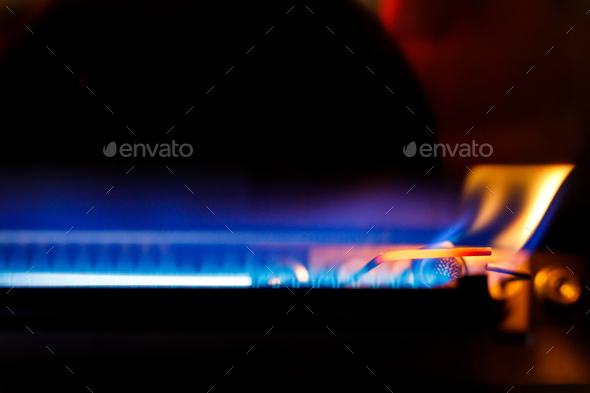Gas boiler igniter. Gas is burning in the boiler.