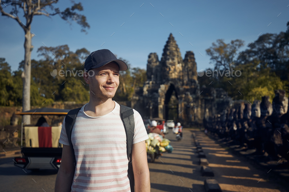 Man admiring monuments in ancient city - Stock Photo - Images