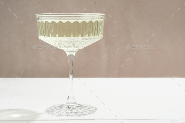 one glass of non alcohol champagne on a table with copy space. sparkling beverage, - Stock Photo - Images