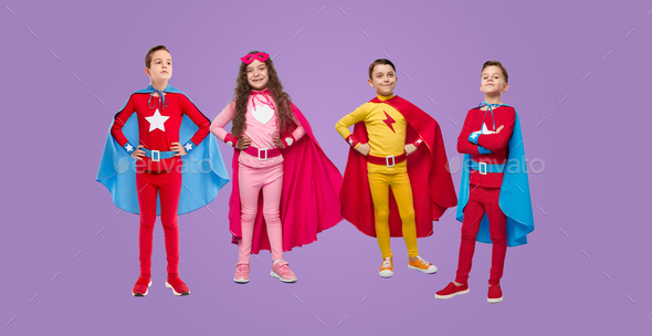 Company of superhero kids in studio
