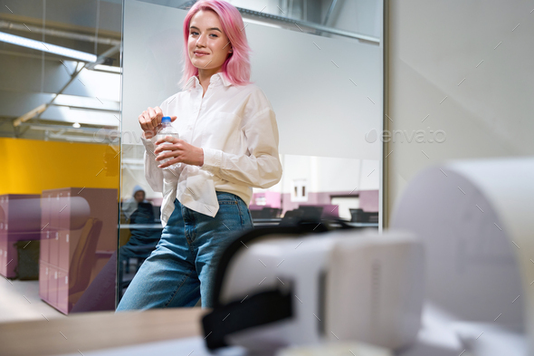 Portrait of lady in the office during lunch break - Stock Photo - Images