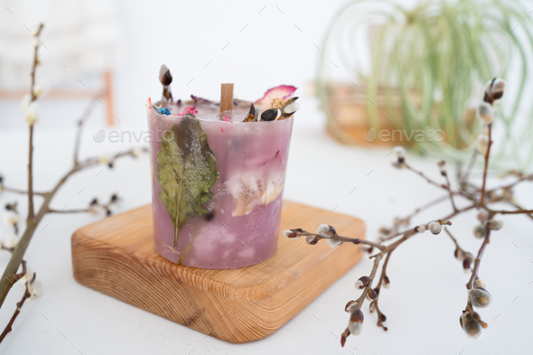 Craft candle with herbarium flowers - Stock Photo - Images