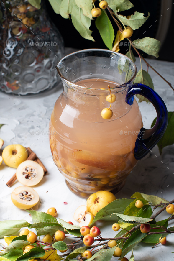 Assorted compote of apples and Japanese quince in a jug, delicious,vitamin drink