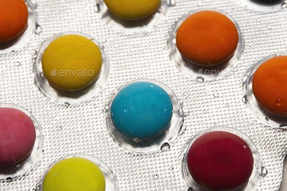 acro view of blister packs with colorful pills - Stock Photo - Images