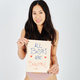 Asian woman smiling and showing body positivity placard - PhotoDune Item for Sale