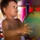 Boy in diaper with ball playing in playroom on weekend - PhotoDune Item for Sale