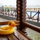 An inflatable duck lies on wooden table in gazebo at recreation center - PhotoDune Item for Sale