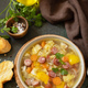 Traditional Zelnacka cabbage soup with sausages and vegetables in a bowl on a stone tabletop. - PhotoDune Item for Sale