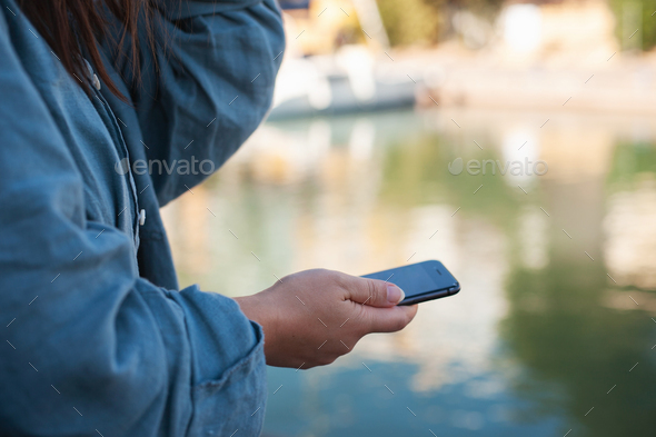 mobile phone in female hands - Stock Photo - Images
