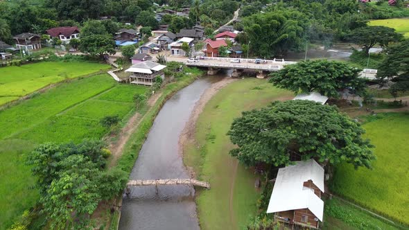 Aerial view of the river and paddy filed in rural mountain village by drone