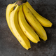 Ripe yellow bananas fruits, bunch of ripe bananas, isolated dark, clipping path. - PhotoDune Item for Sale