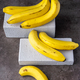 Ripe yellow bananas fruits, bunch of ripe bananas, isolated dark, clipping path. - PhotoDune Item for Sale