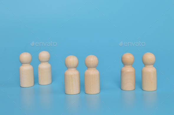Wooden doll figures of people standing together