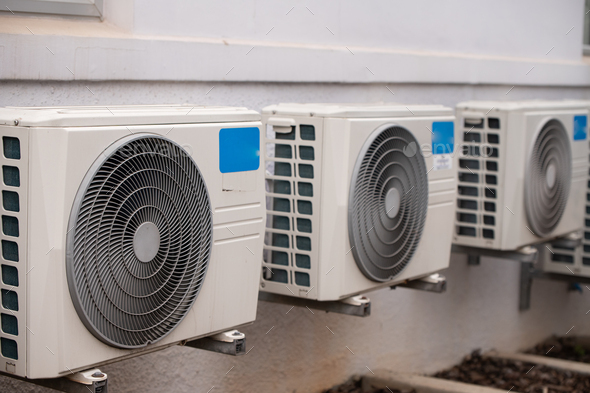 Air conditioners mounted on wall outdoors - Stock Photo - Images