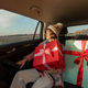 Woman in car with Christmas presents - PhotoDune Item for Sale