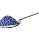 Teaspoon with butterfly pea flower powder or blue matcha tea isolated on white. - PhotoDune Item for Sale